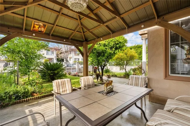 a view of a livingroom with wooden floor and a fireplace