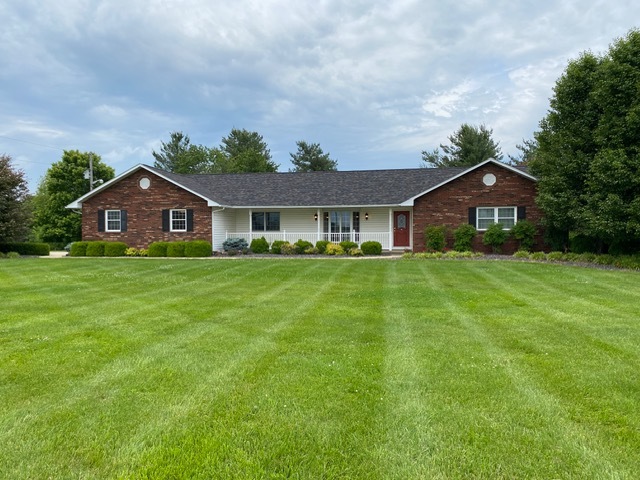 a front view of a house with a yard