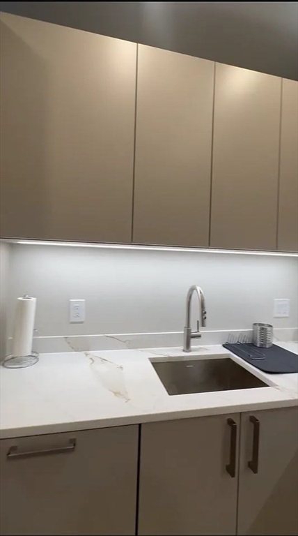44-46 Temple Place, Unit 3 Boston, MA 02111 - Photo 4 of 11 a close view of sink and tap