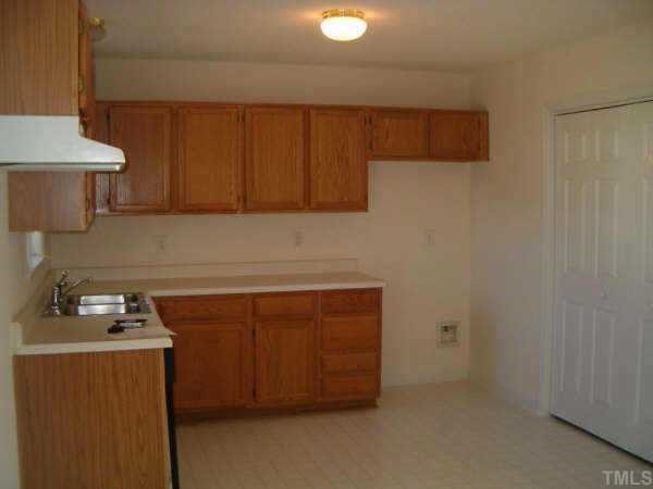 5705 Chinook Court Raleigh, NC 27610 - Photo 3 of 8 a room with storage and utility