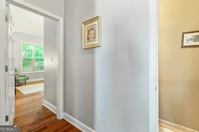 a bedroom with a bed and glass window