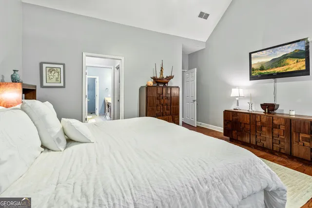 a view of a bedroom from a hallway