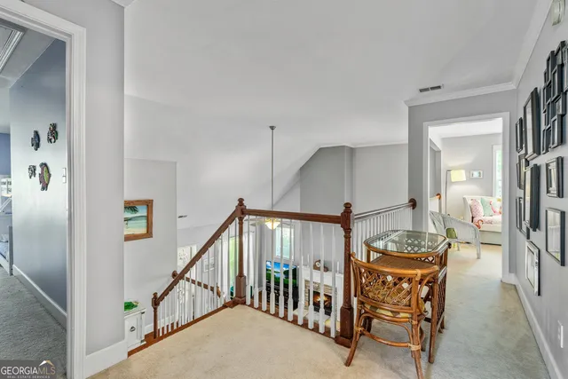 a view of a hallway with seating area