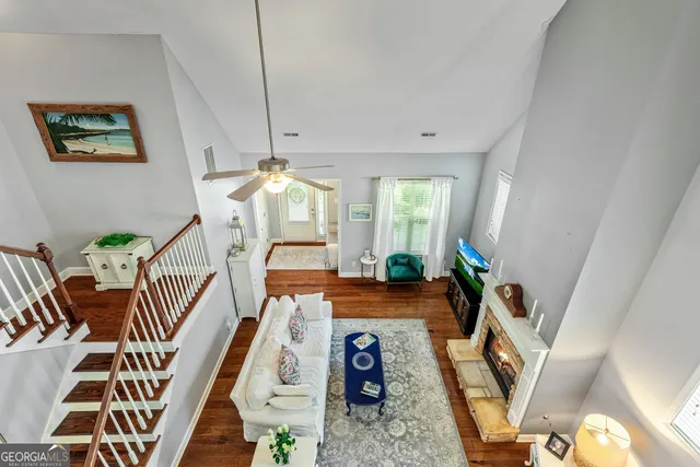 a bathroom with a sink a toilet and shower curtain