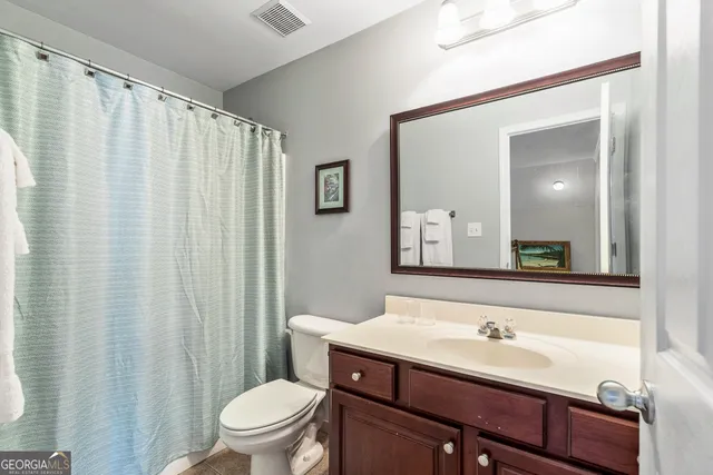 a view of a livingroom with furniture and a window