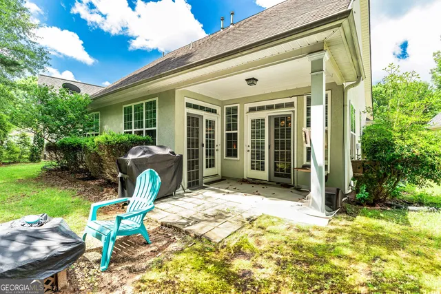 a aerial view of a house with a yard