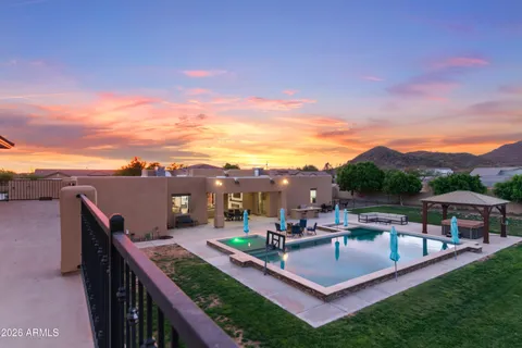 a view of a roof deck with couches and city view
