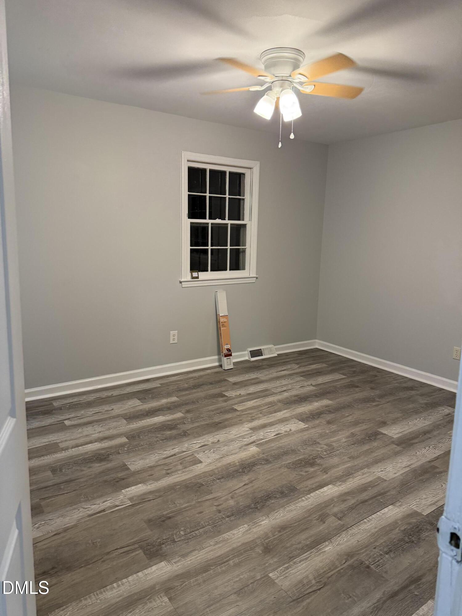 2800 Greenock Drive Raleigh, NC 27604 - Photo 14 of 20 a view of empty room with window and ceiling fan