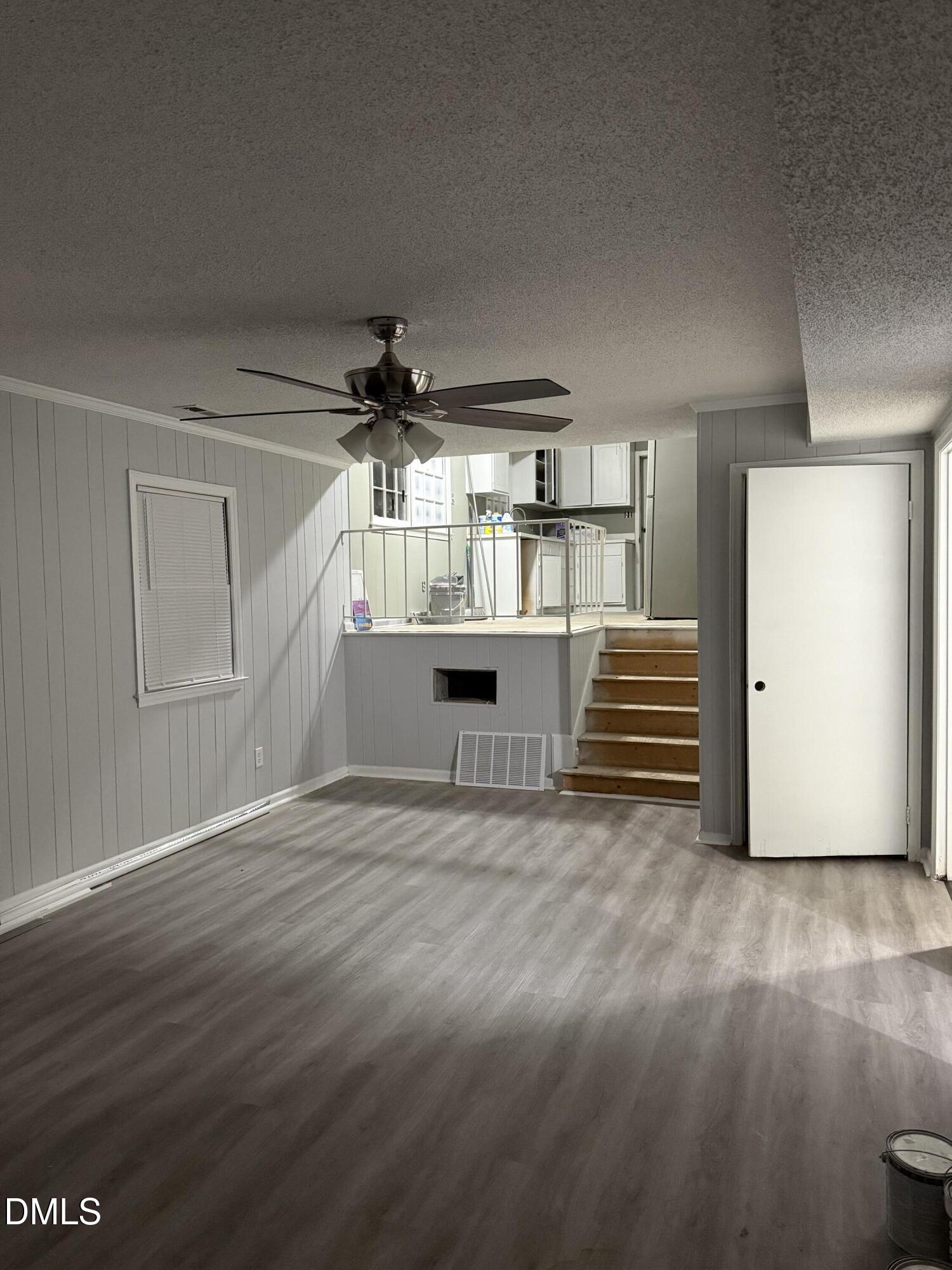 2800 Greenock Drive Raleigh, NC 27604 - Photo 4 of 20 a view of empty room with wooden floor and windows