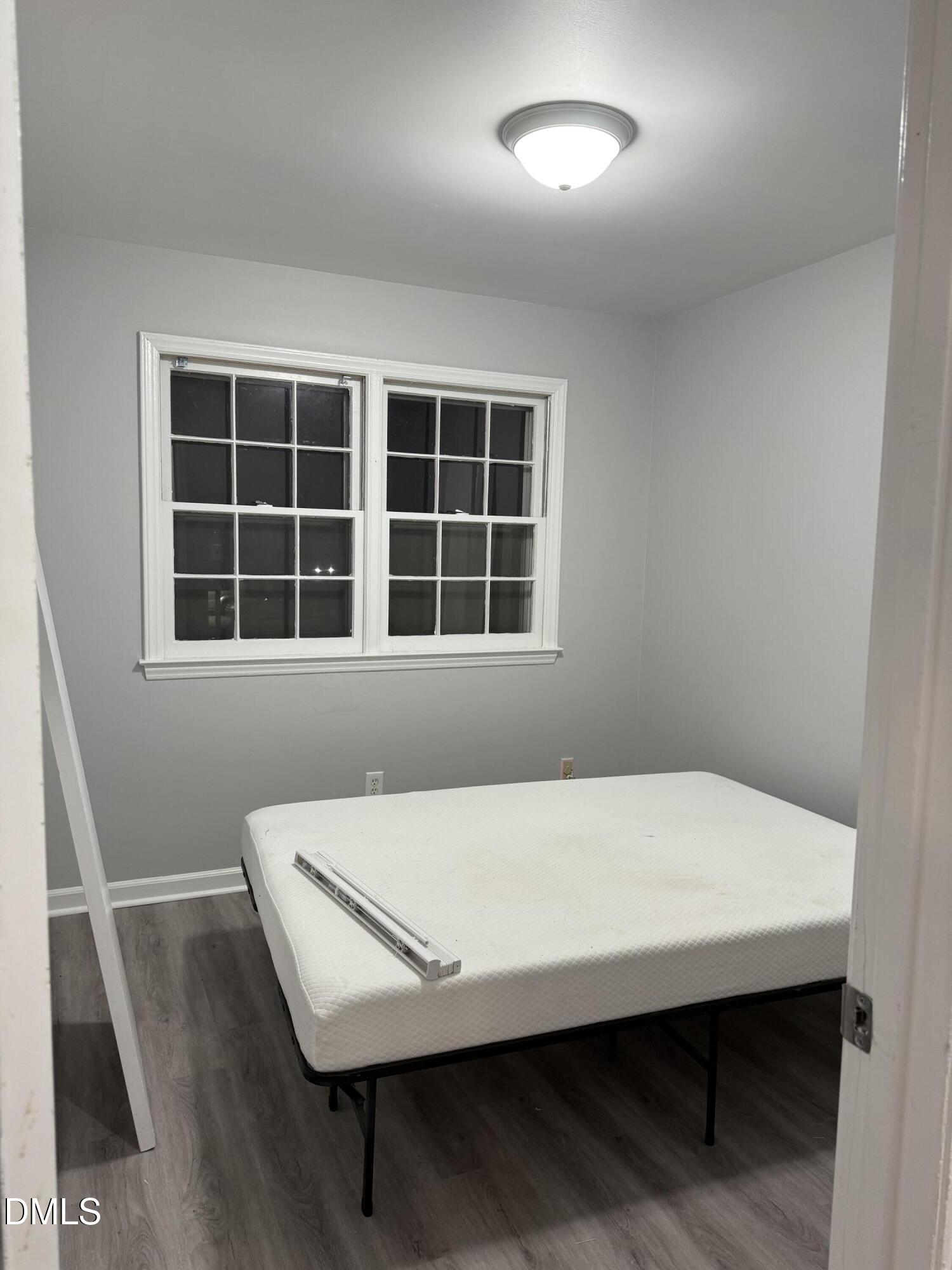 2800 Greenock Drive Raleigh, NC 27604 - Photo 10 of 20 a bed sitting in a bedroom next to a window