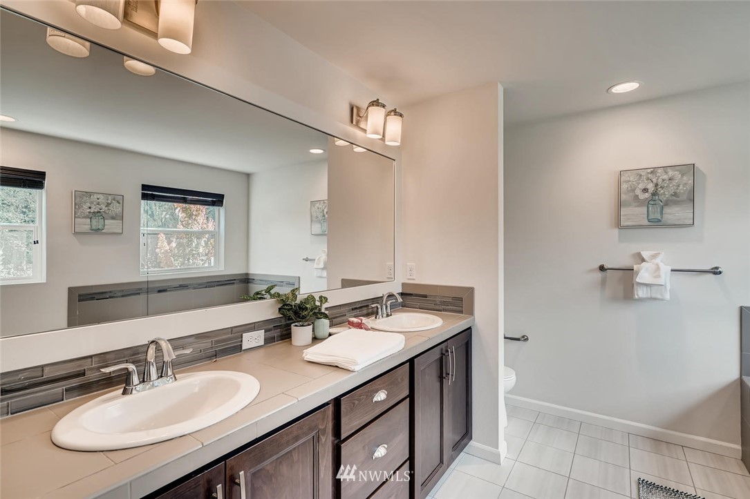 19804 35th Drive Southeast Bothell, WA 98012 - Photo 14 of 22 a bathroom with a sink double vanity and a mirror
