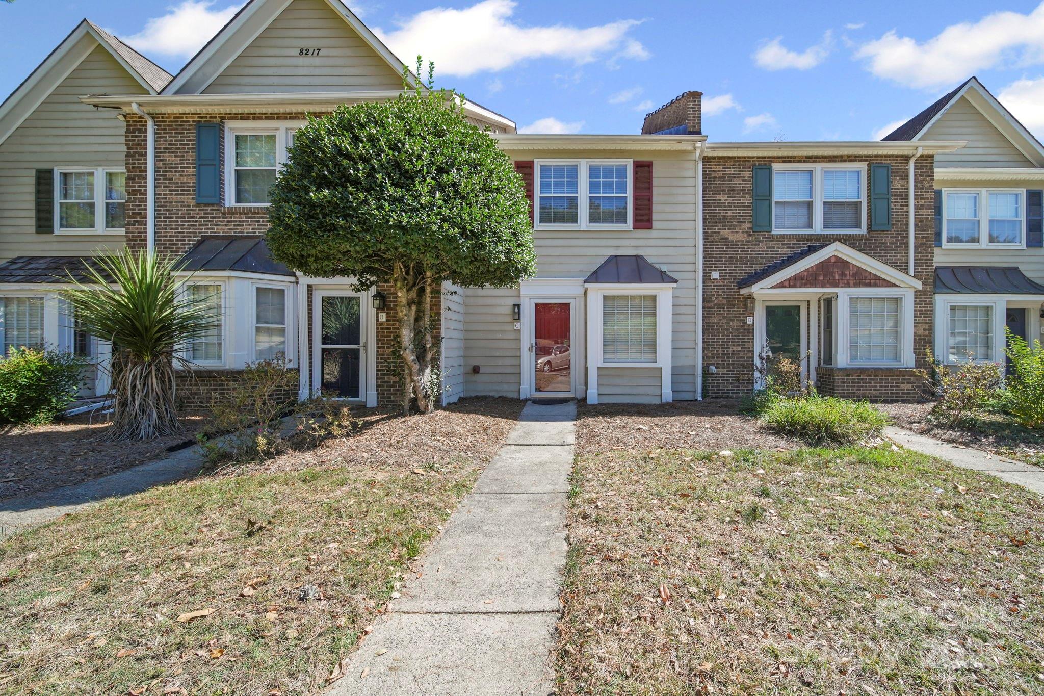 a front view of a house with a yard
