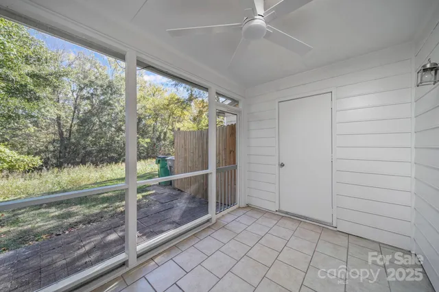 an empty room with wooden floor view and balcony