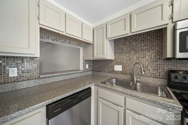 a kitchen with a sink and cabinets