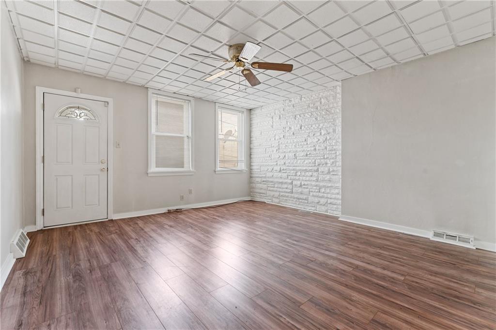 415 Gardner Street McKees Rocks, PA 15136 - Photo 14 of 22 wooden floor in an empty room with a window