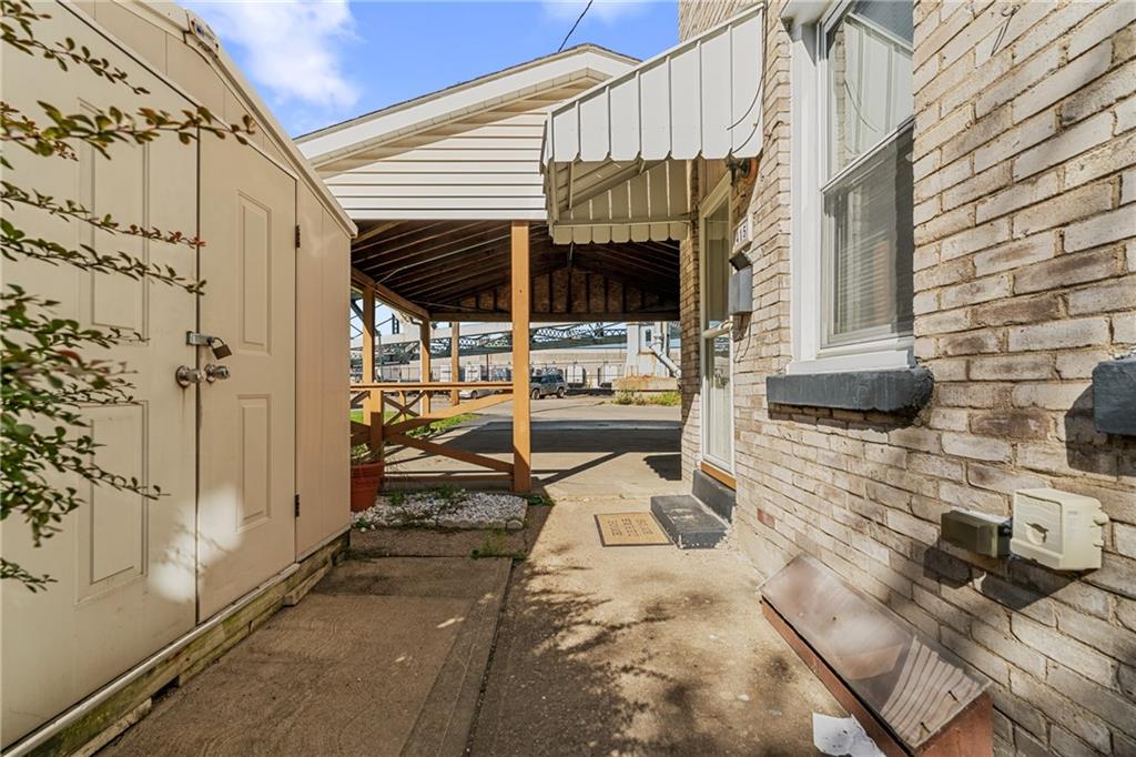 415 Gardner Street McKees Rocks, PA 15136 - Photo 7 of 22 a view of a patio with table and chairs with wooden floor and fence