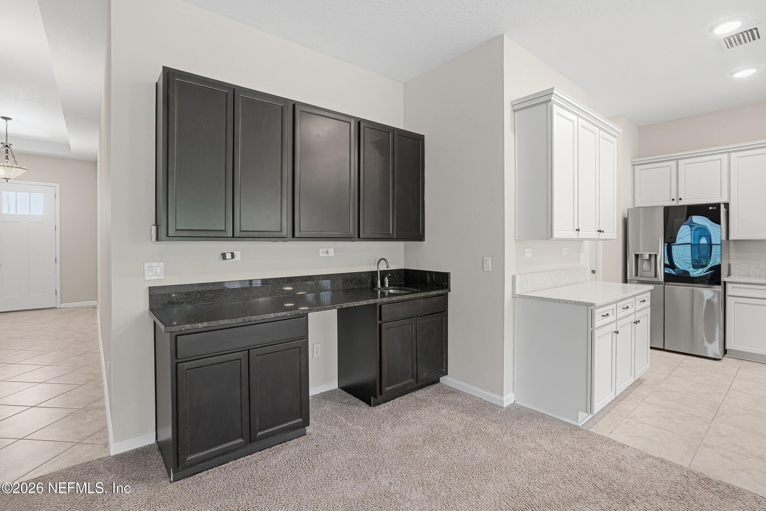 308 Rustic Mill Drive St. Augustine, FL 32092 - Photo 15 of 41 a kitchen with stainless steel appliances granite countertop a stove and a sink