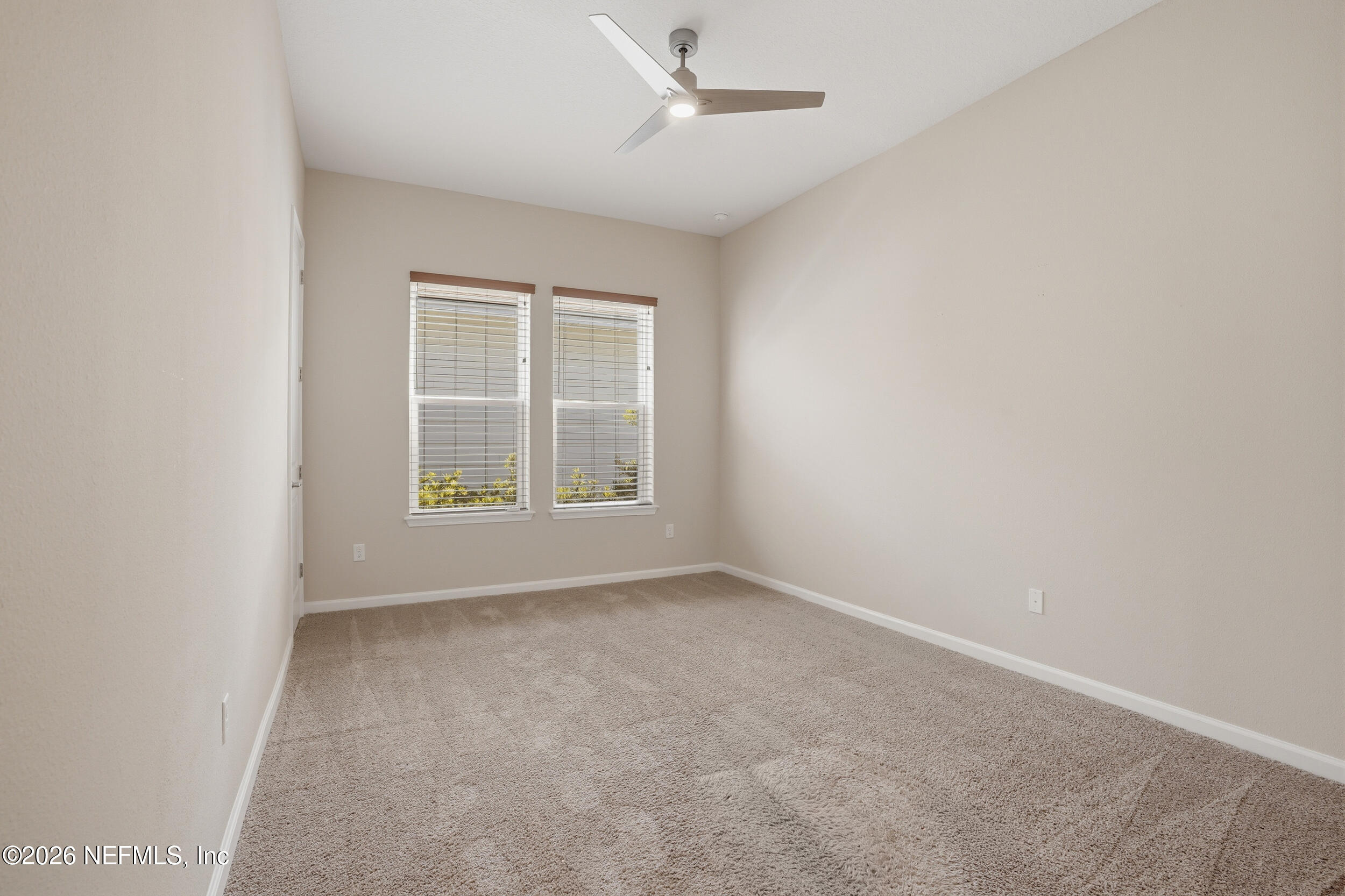 308 Rustic Mill Drive St. Augustine, FL 32092 - Photo 18 of 41 an empty room with windows and fan