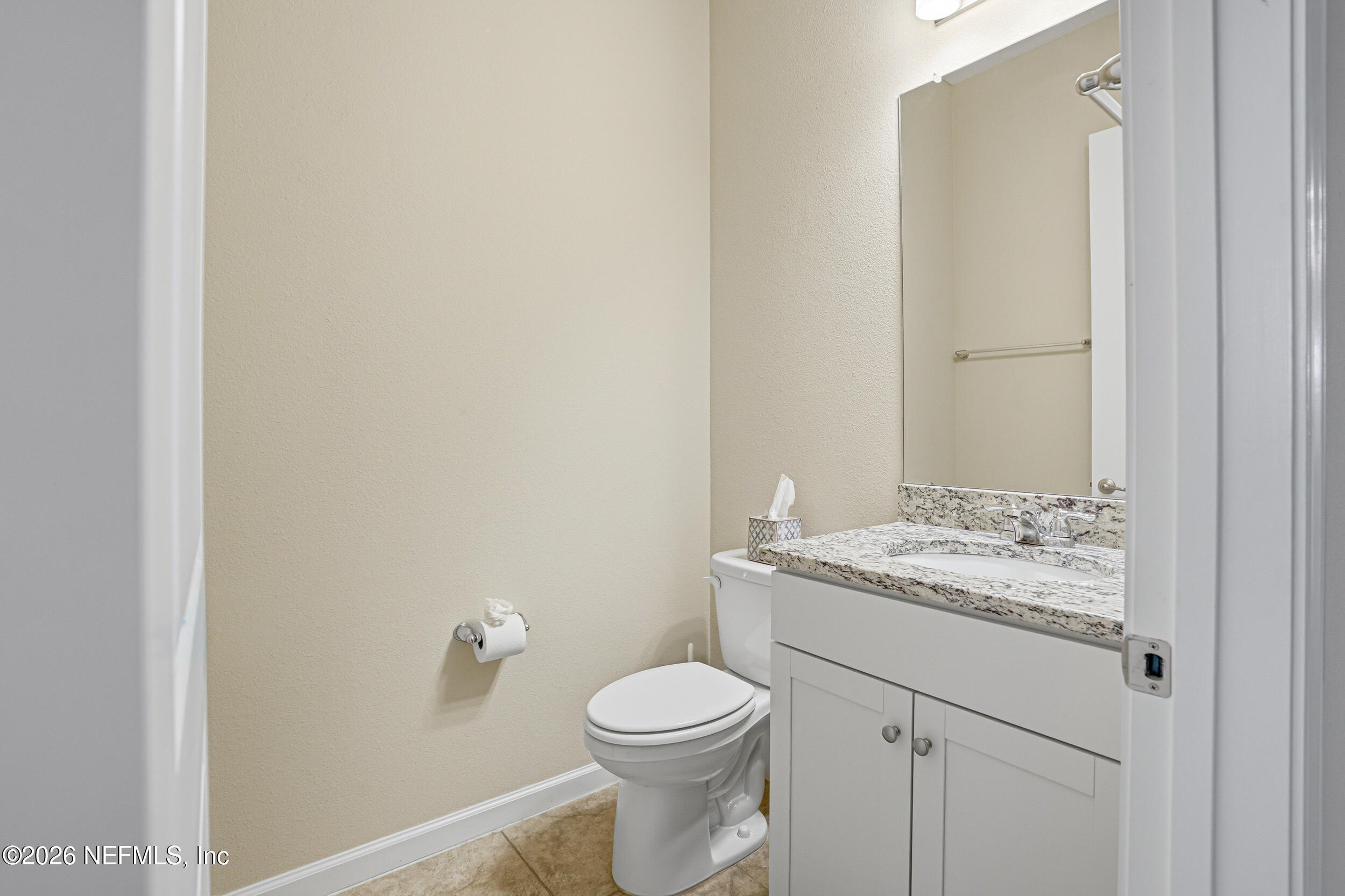 308 Rustic Mill Drive St. Augustine, FL 32092 - Photo 19 of 41 a bathroom with a granite countertop toilet and a sink