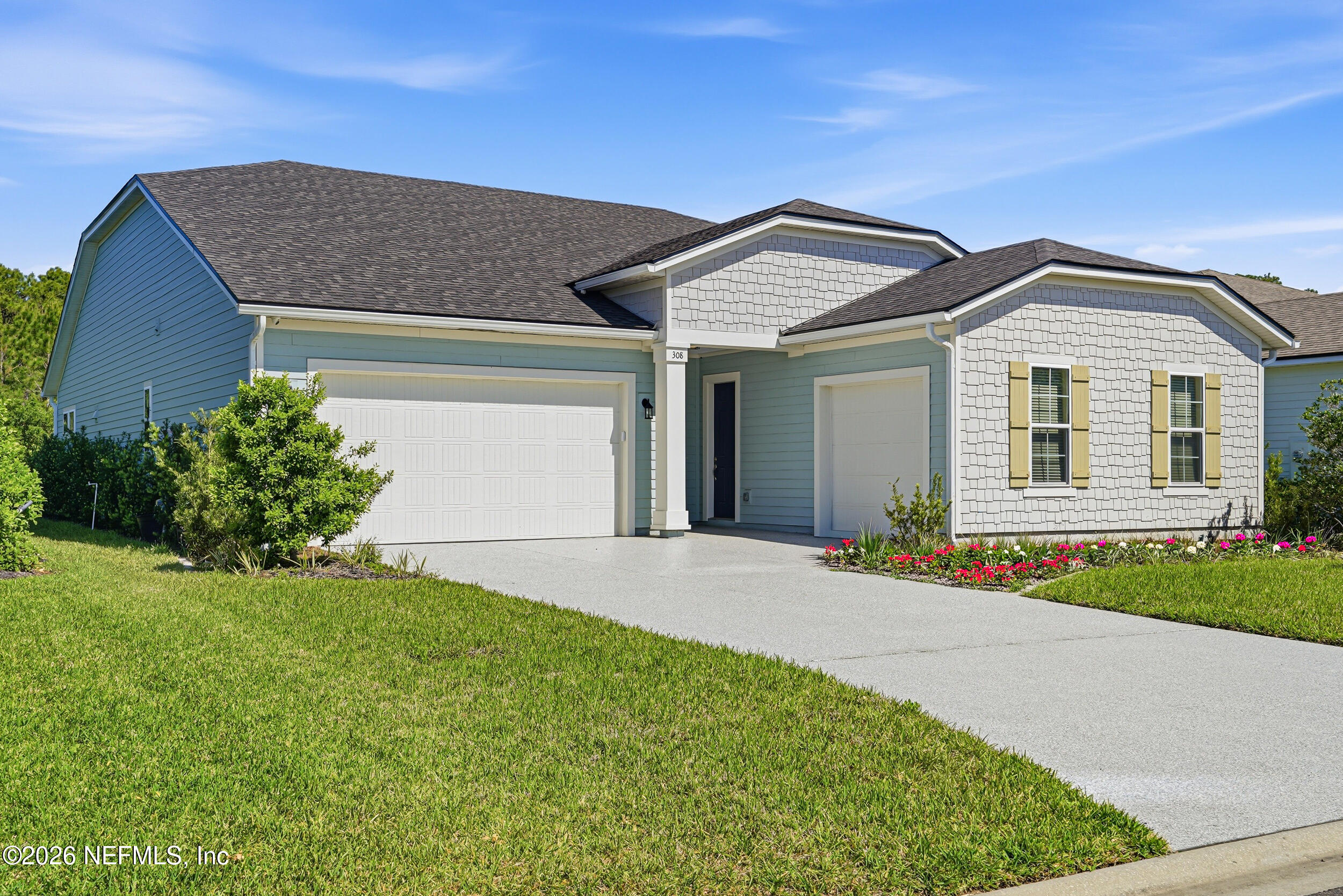 308 Rustic Mill Drive St. Augustine, FL 32092 - Photo 7 of 41 a front view of a house with a yard and garage