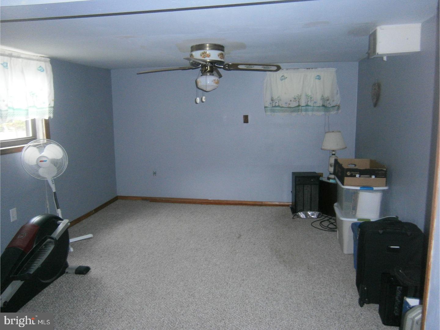 254 Telegraph Road Alloway, NJ 08302 - Photo 14 of 22 a view of a room with gym equipment and windows