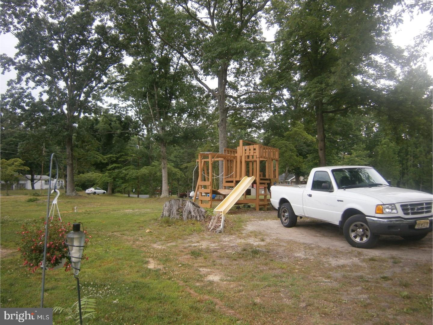 254 Telegraph Road Alloway, NJ 08302 - Photo 22 of 22 a view of a backyard with swings