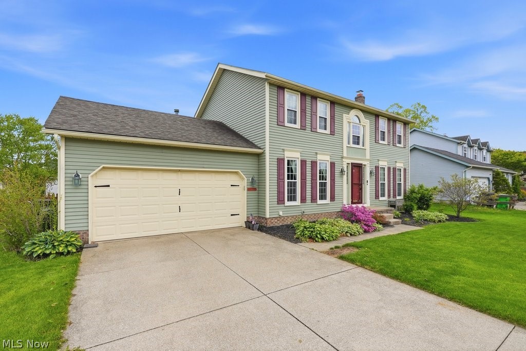 5321 Young Road Stow, OH 44224 - Photo 2 of 37 Two-story residence featuring light green siding and a contrasting dark roof
