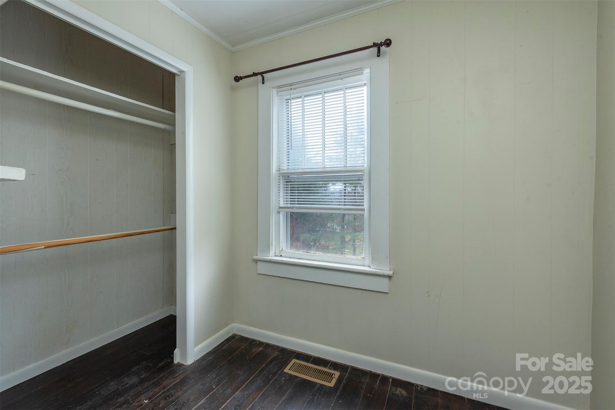657 Old Fort Road Fairview, NC 28730 - Photo 12 of 30 a view of an empty room with wooden floor and a window