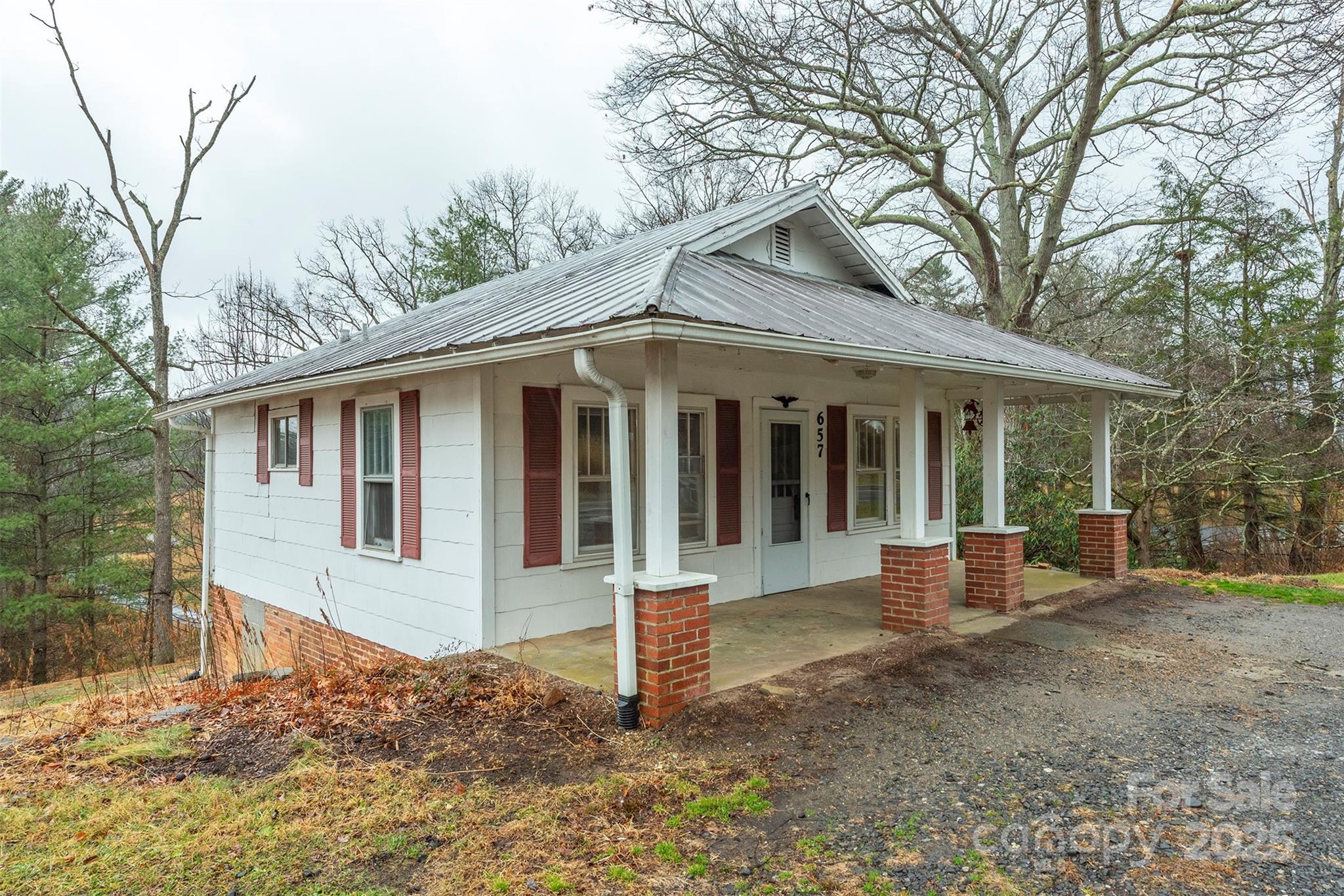 657 Old Fort Road Fairview, NC 28730 - Photo 2 of 30 a front view of a house with a yard