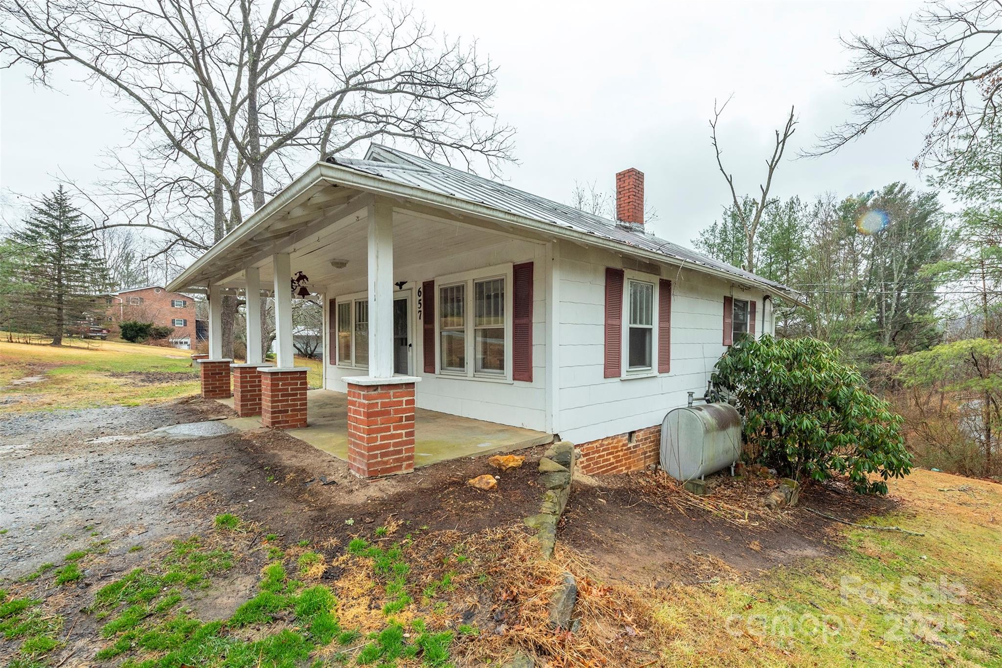 657 Old Fort Road Fairview, NC 28730 - Photo 4 of 30 a front view of a house with a yard