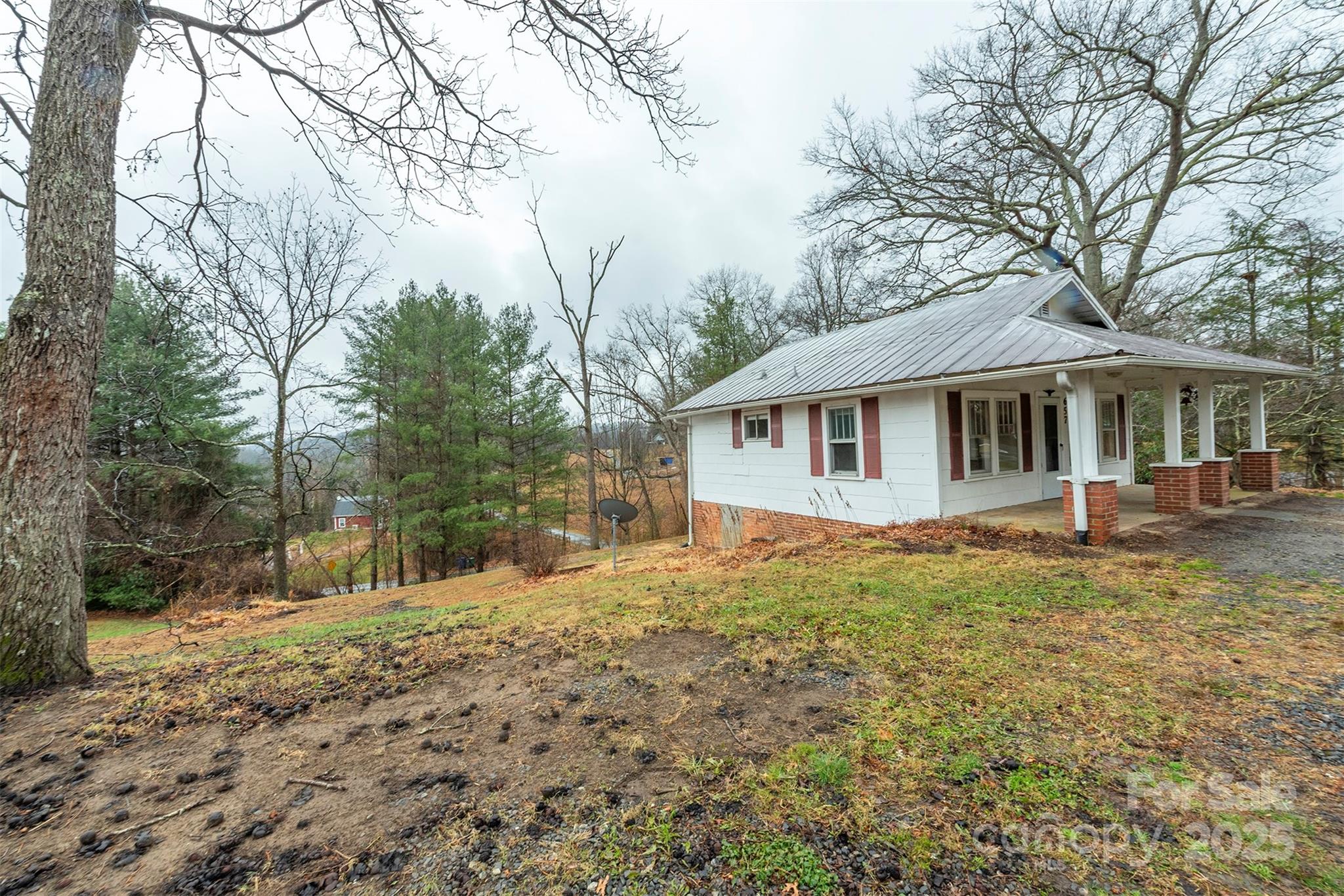 657 Old Fort Road Fairview, NC 28730 - Photo 5 of 30 a front view of a house with a yard
