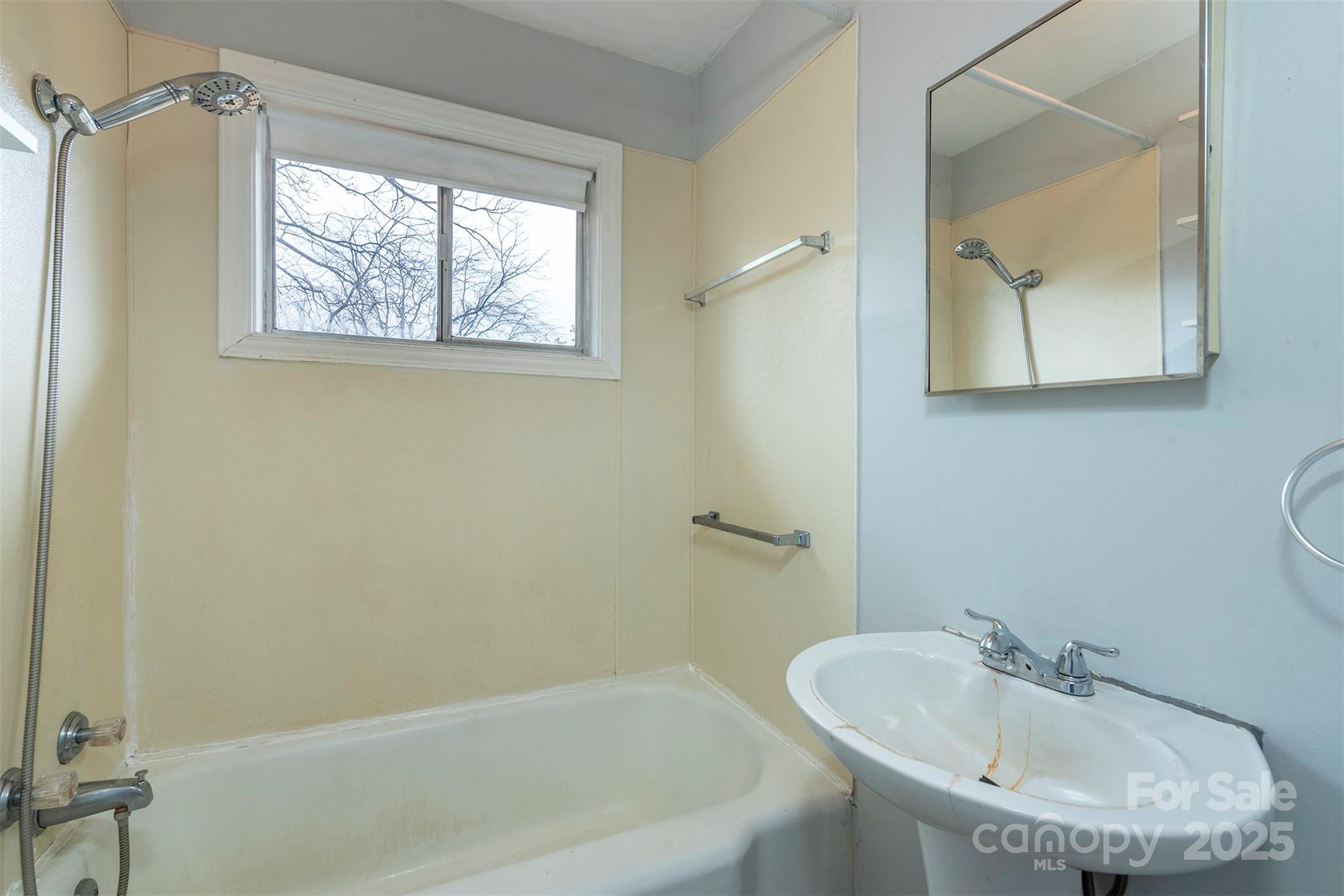 657 Old Fort Road Fairview, NC 28730 - Photo 10 of 30 a bathroom with a sink and a bathtub