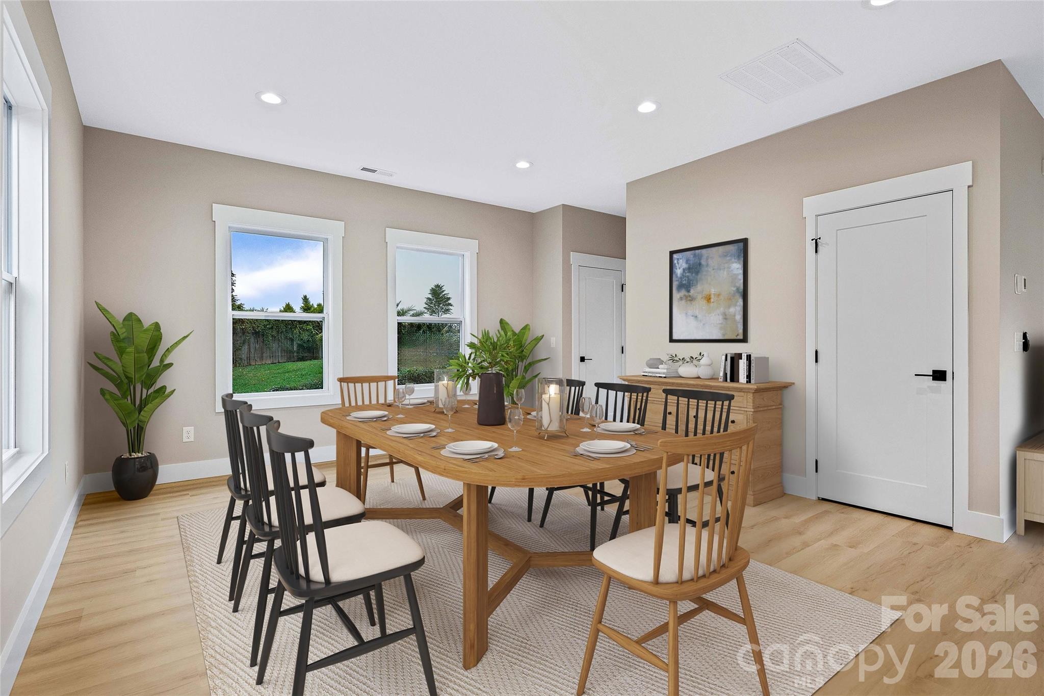428 Hazel Mill Road Asheville, NC 28806 - Photo 22 of 46 a view of a dining room with furniture and wooden floor