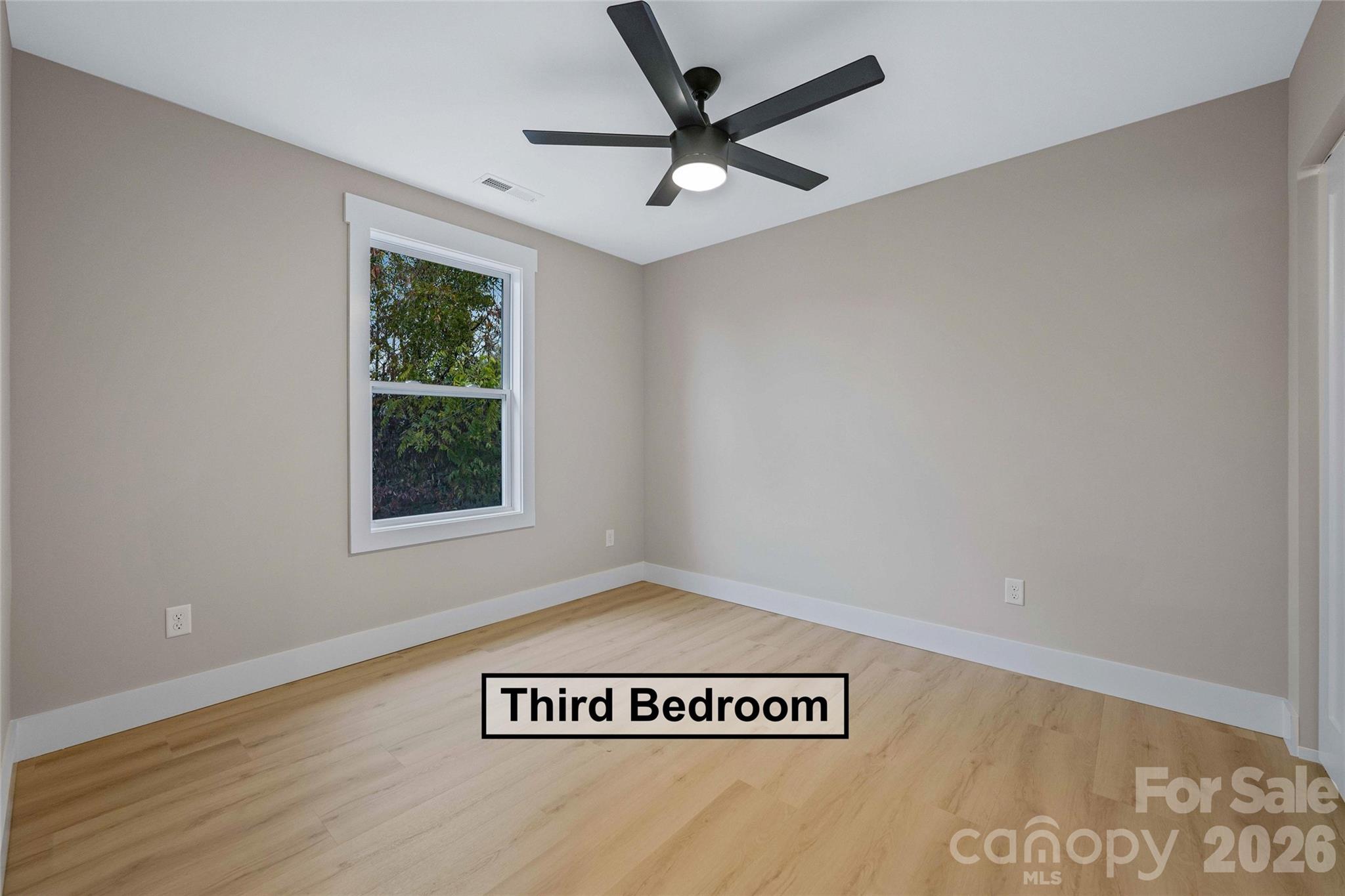 428 Hazel Mill Road Asheville, NC 28806 - Photo 39 of 46 a view of a ceiling fan with a window