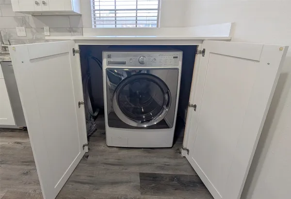 a utility room with washer and dryer