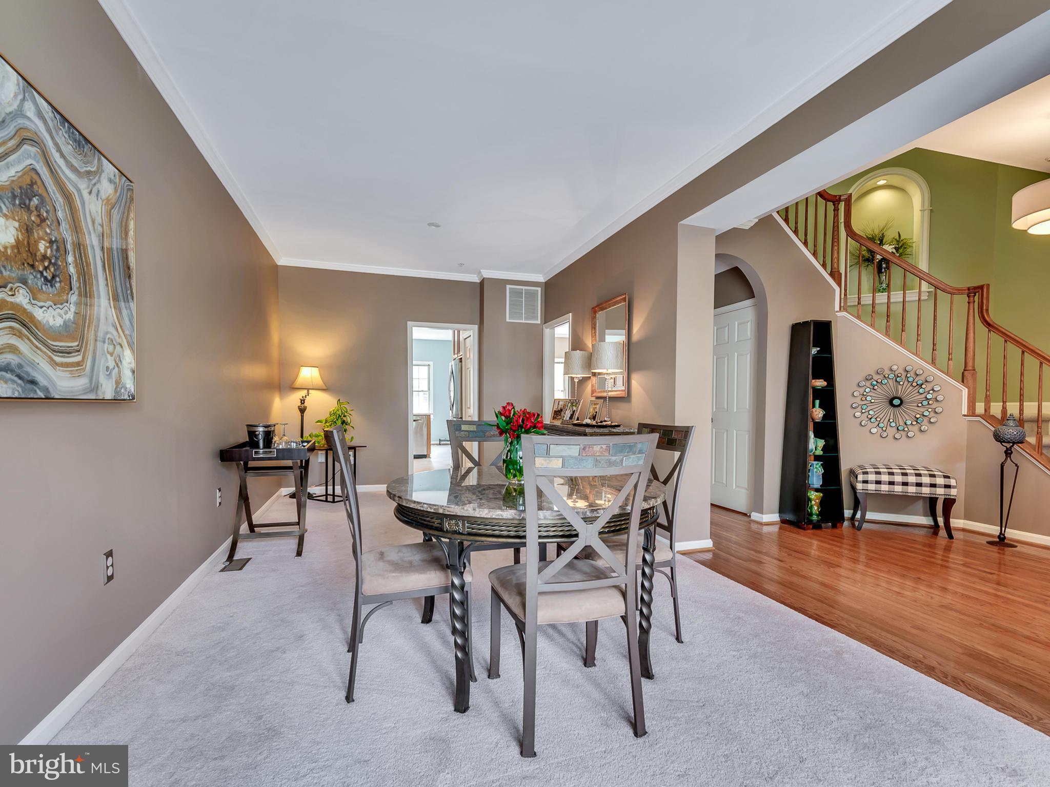 2441 Rippling Brook Road Frederick, MD 21701 - Photo 8 of 30 a view of a dining room with furniture and wooden floor