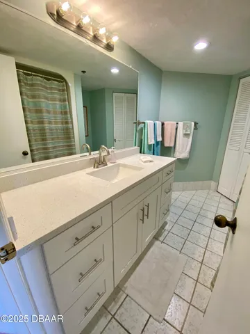 a bathroom with a sink a vanity and a mirror