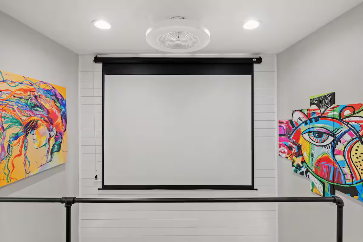 307 East 35th Street, Unit A Austin, TX 78705 - Photo 39 of 40 A dedicated media space features a projector screen and recessed lighting.