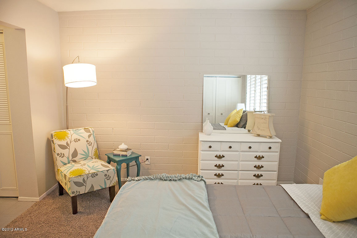 4101 East Camelback Road, Unit 16 Phoenix, AZ 85018 - Photo 15 of 27 Master bedroom with room for a chair and