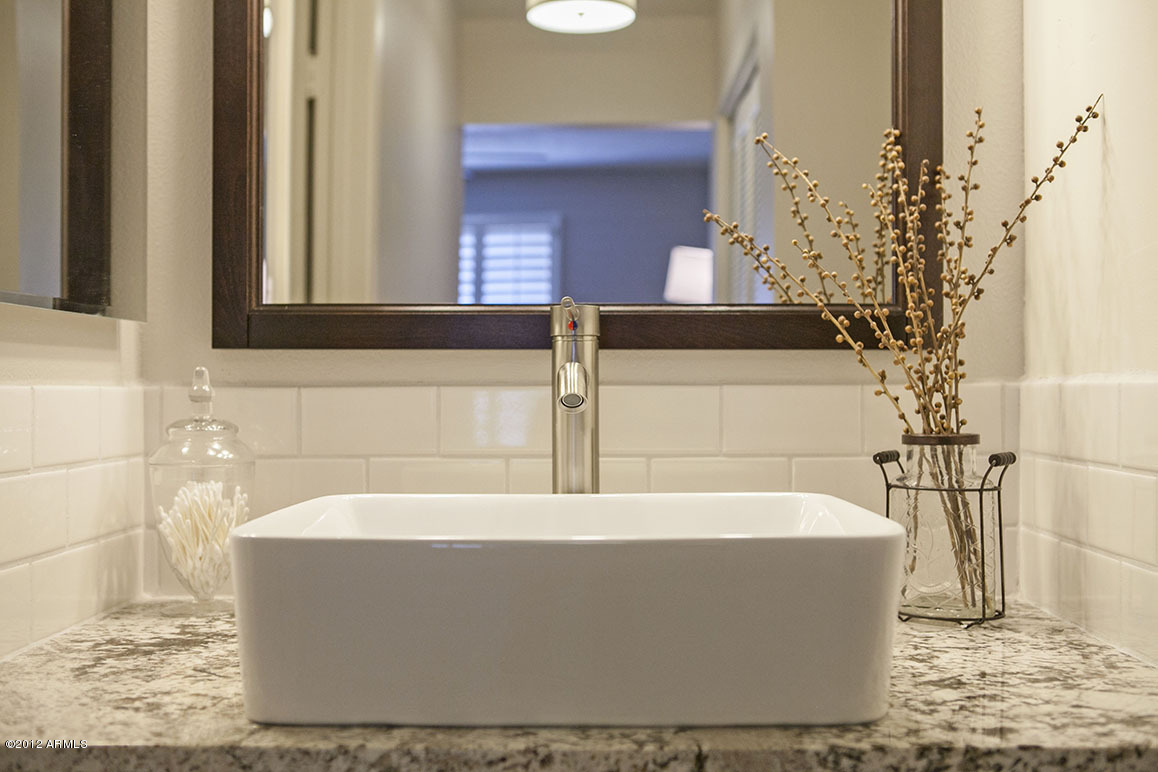 4101 East Camelback Road, Unit 16 Phoenix, AZ 85018 - Photo 19 of 27 Master bathroom sink and subway tile bac