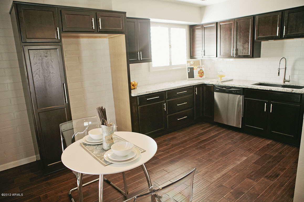4101 East Camelback Road, Unit 16 Phoenix, AZ 85018 - Photo 8 of 27 Brand new dark wood cabinets with soft c