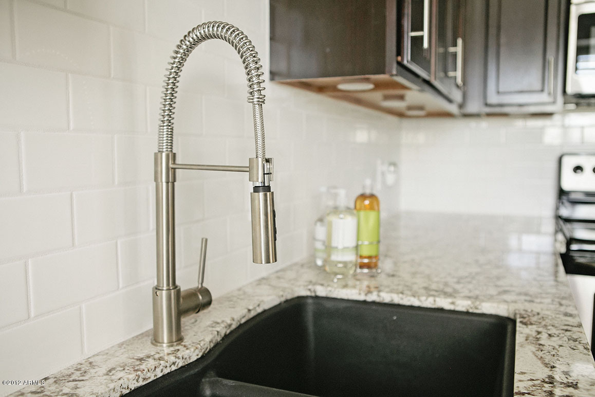 4101 East Camelback Road, Unit 16 Phoenix, AZ 85018 - Photo 10 of 27 Black granite sink and stainless steel f
