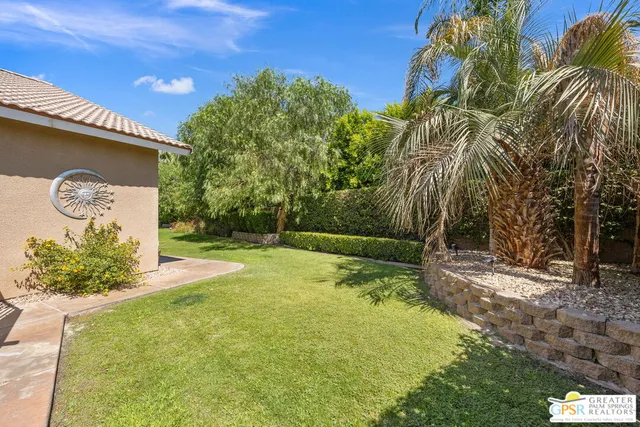 a backyard of a house with lots of green space