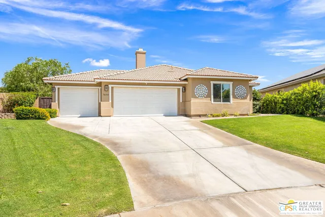 a front view of a house with yard