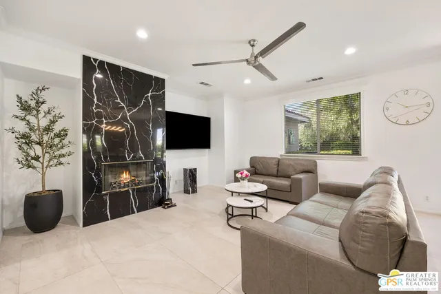 a living room with furniture and a large window