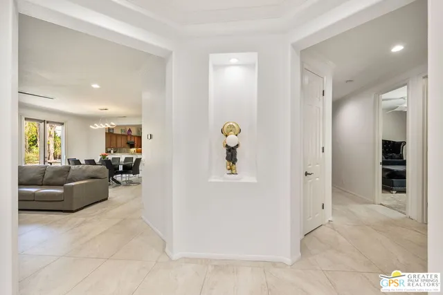 a bedroom with a bed lamp and window