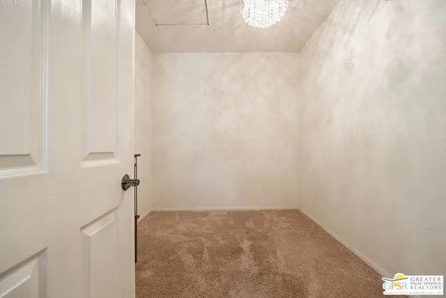 a spacious bathroom with a granite countertop sink a mirror and bathtub