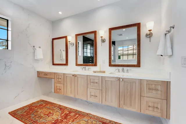a dining room with furniture and a view of kitchen