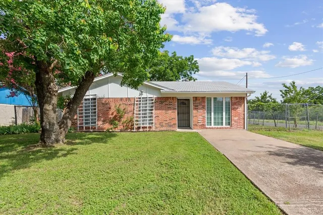 front view of a house with a yard