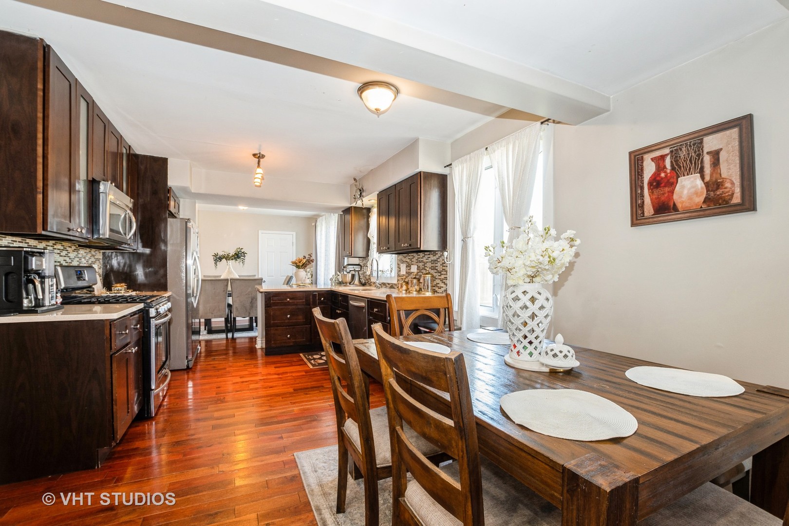 8036 Fawn Trail Justice, IL 60458 - Photo 2 of 16 a view of a dining room with furniture and wooden floor